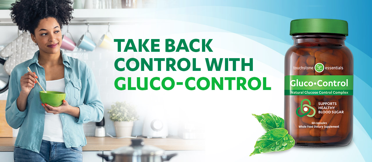 Woman looking at bottle of Gluco-Control Woman looking at bottle of Gluco-Control